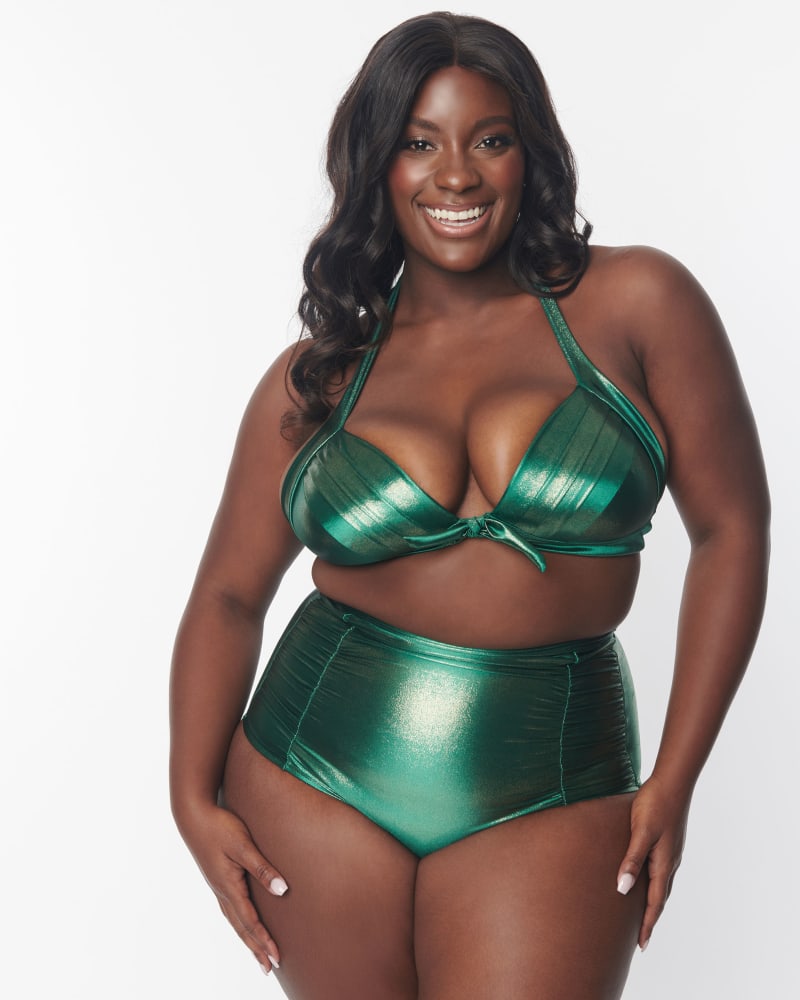 Front of a model wearing a size 1X Unique Vintage Metallic Emerald Monroe Halter Swim Top in Metallic Emerald by Unique Vintage. | dia_product_style_image_id:331896